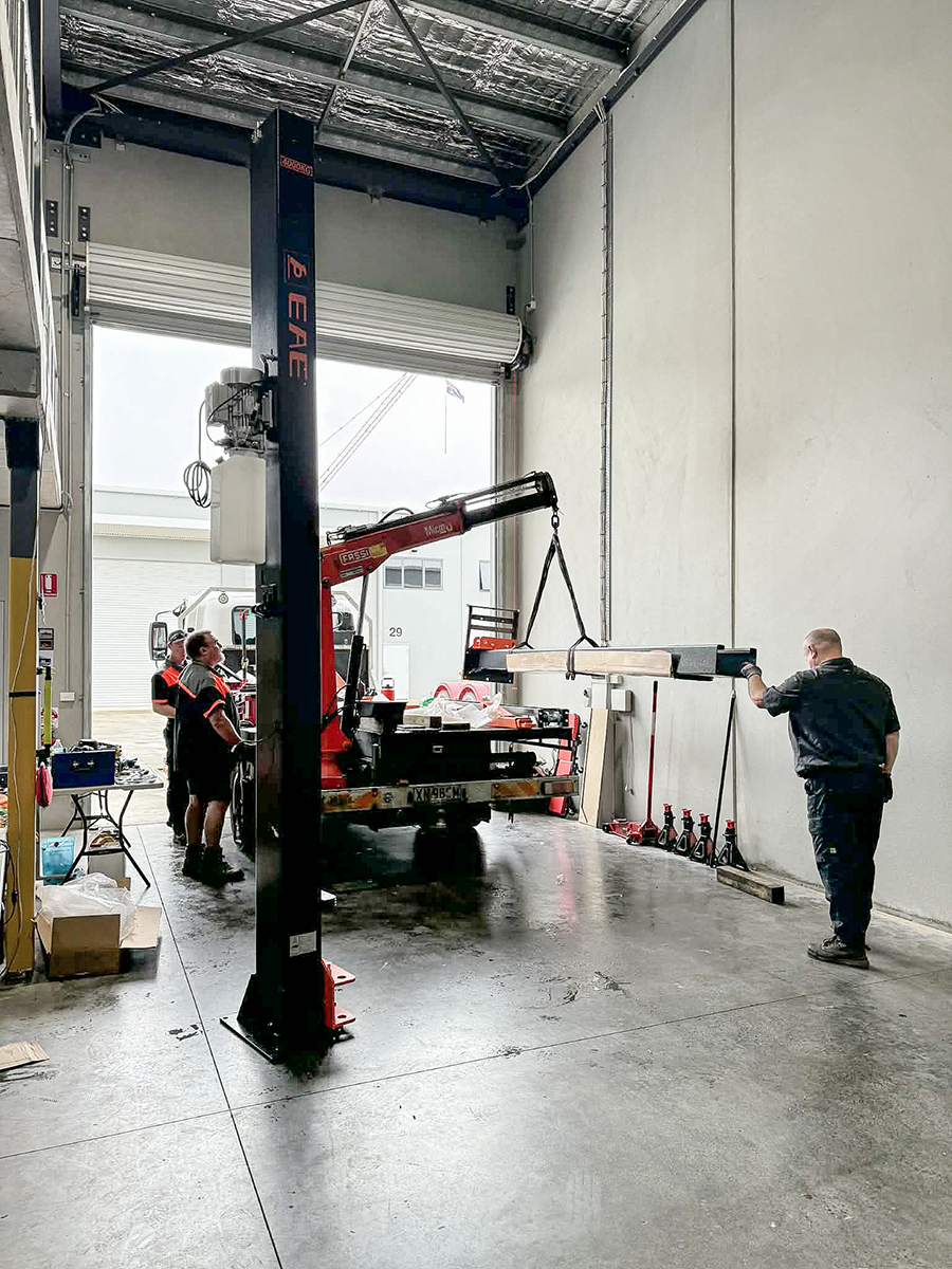 Equipment being positioned during workshop setup.