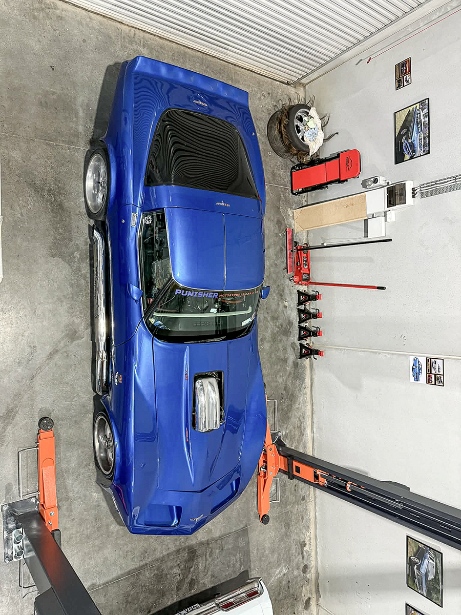 A blue Corvette in the workshop.